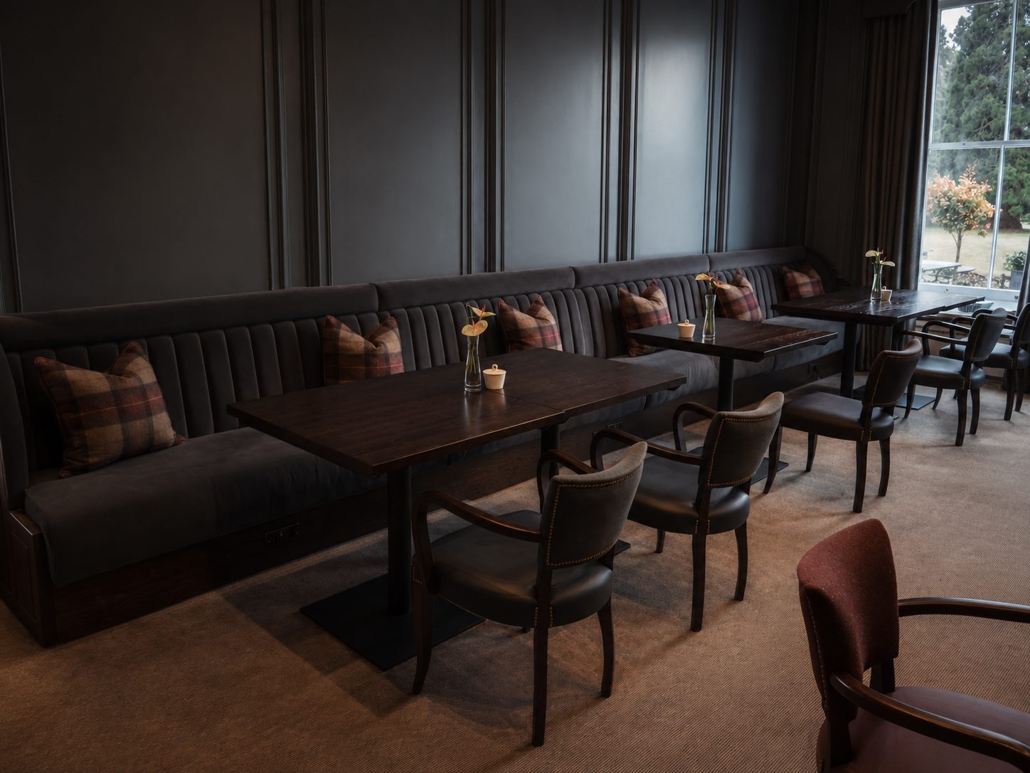 Bespoke fixed seating in a panelled hotel lounge