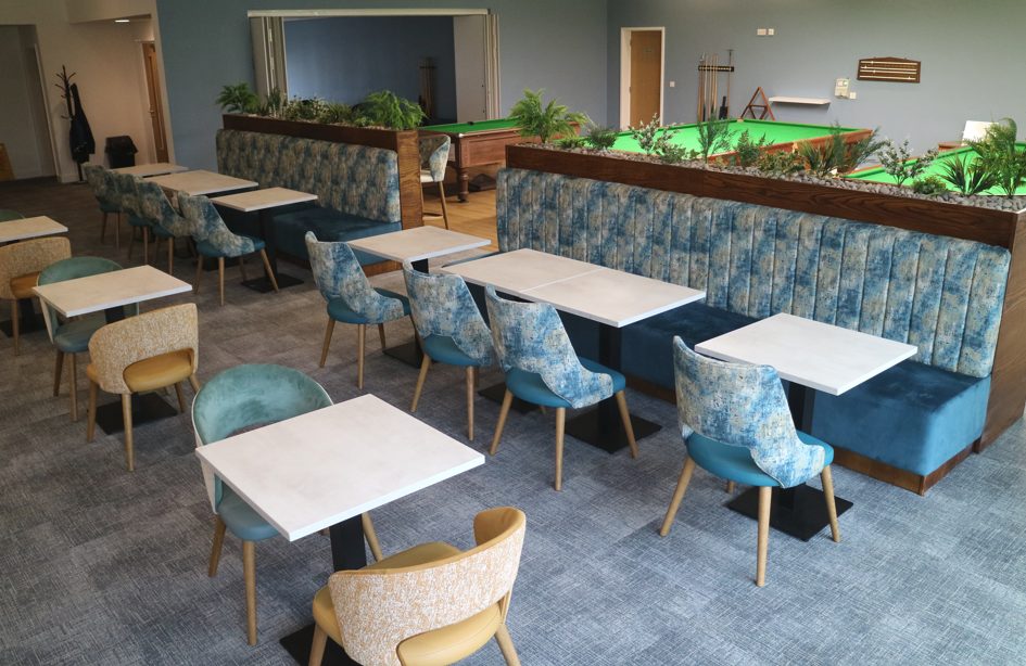 Sports club interior design at Whittingham Club with teal fluted banquettes and planters