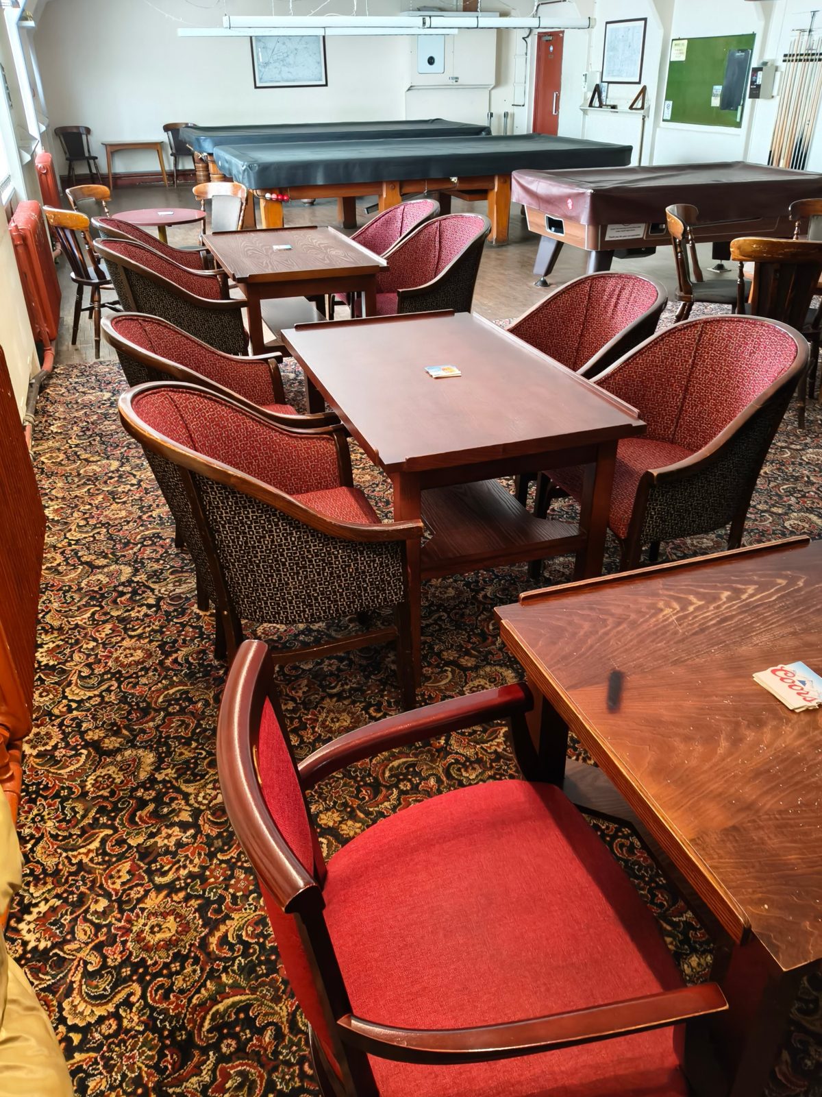 Old Whittingham clubhouse lounge with red tub chairs