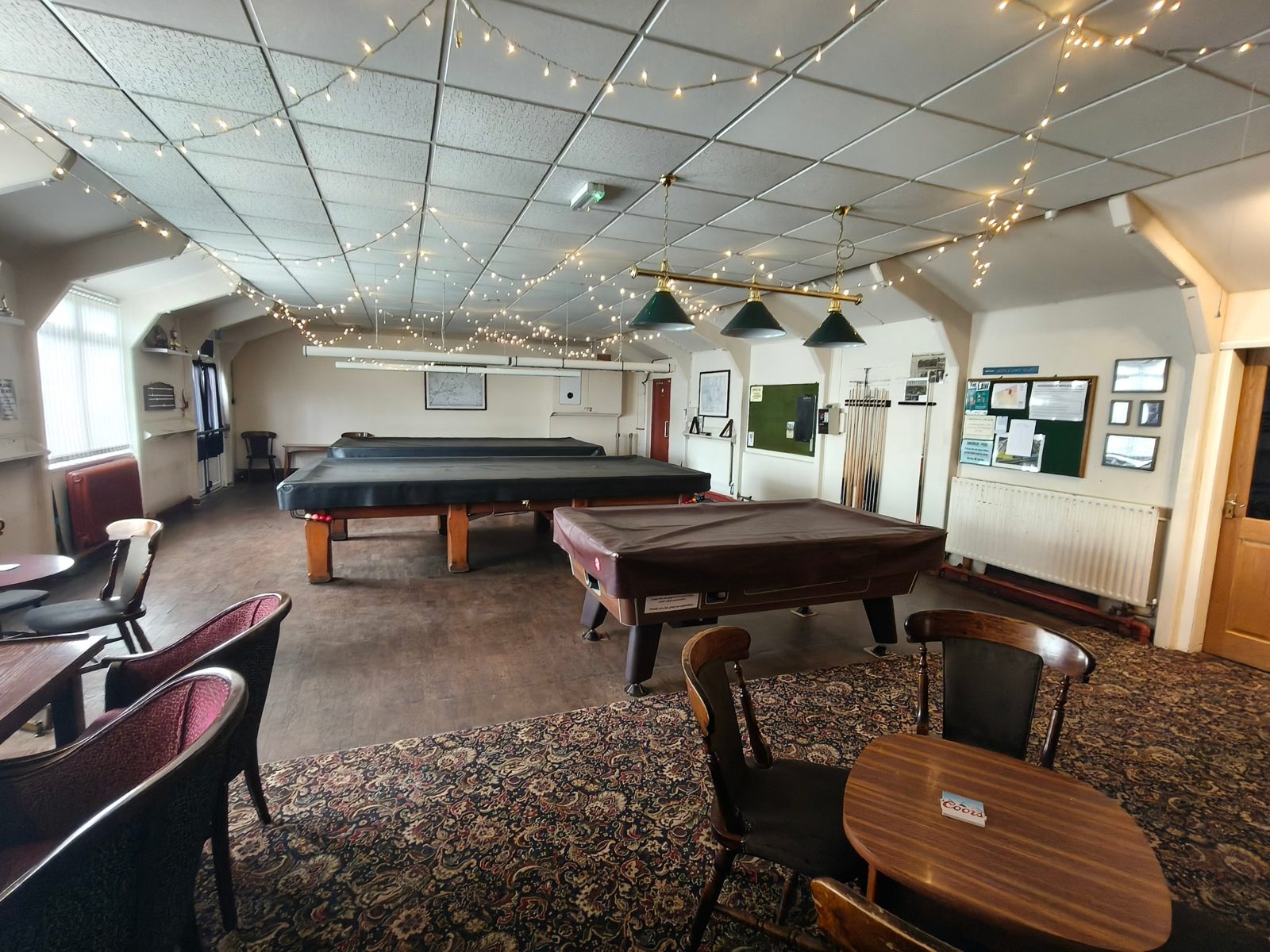 Old club snooker room with patterned carpet